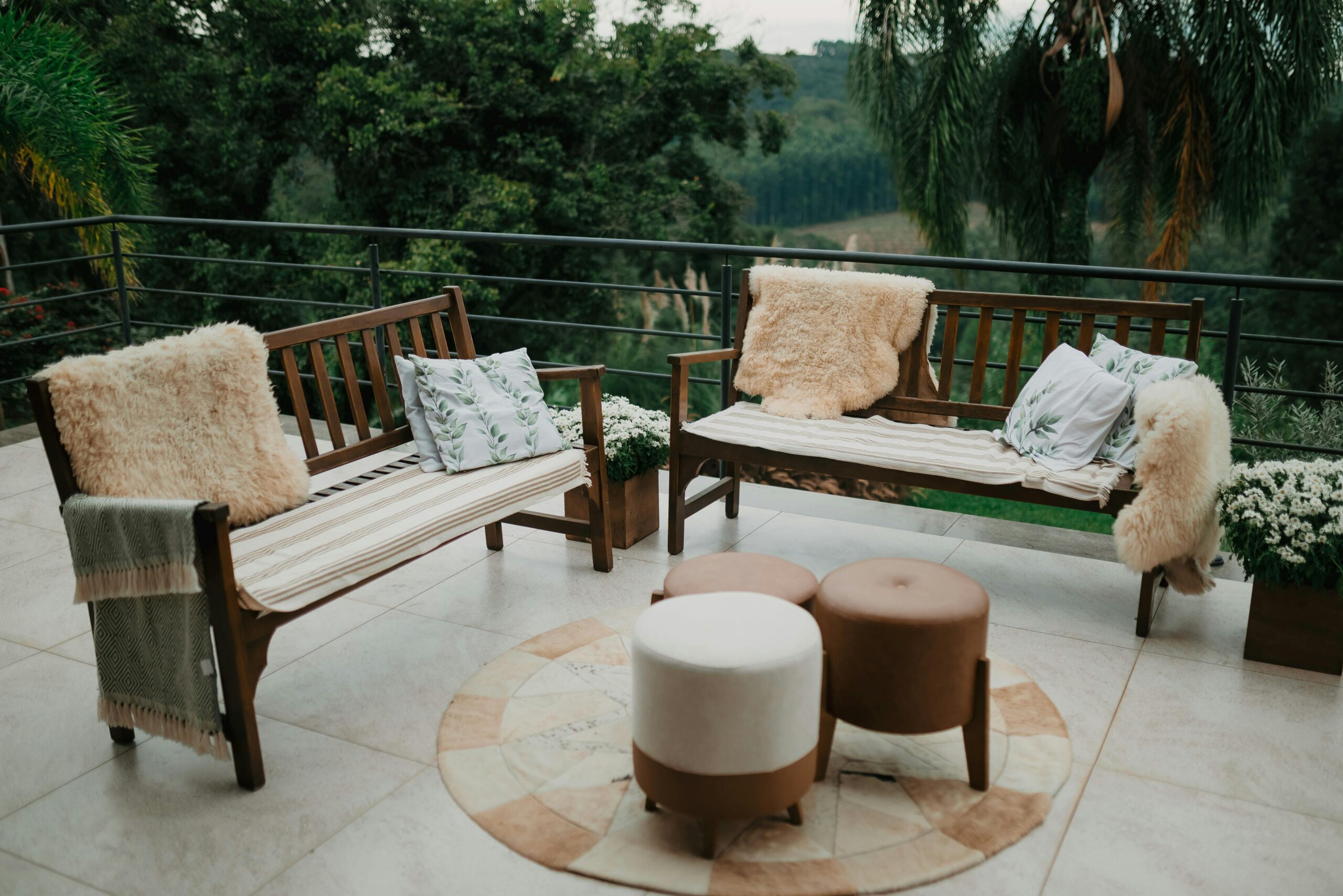 Cozy Outdoor Patio with Wooden Furniture and Garden View